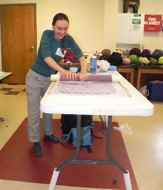 A happy student learning to web felt at Deb Tewell's class at the Estes Park Wool Festival